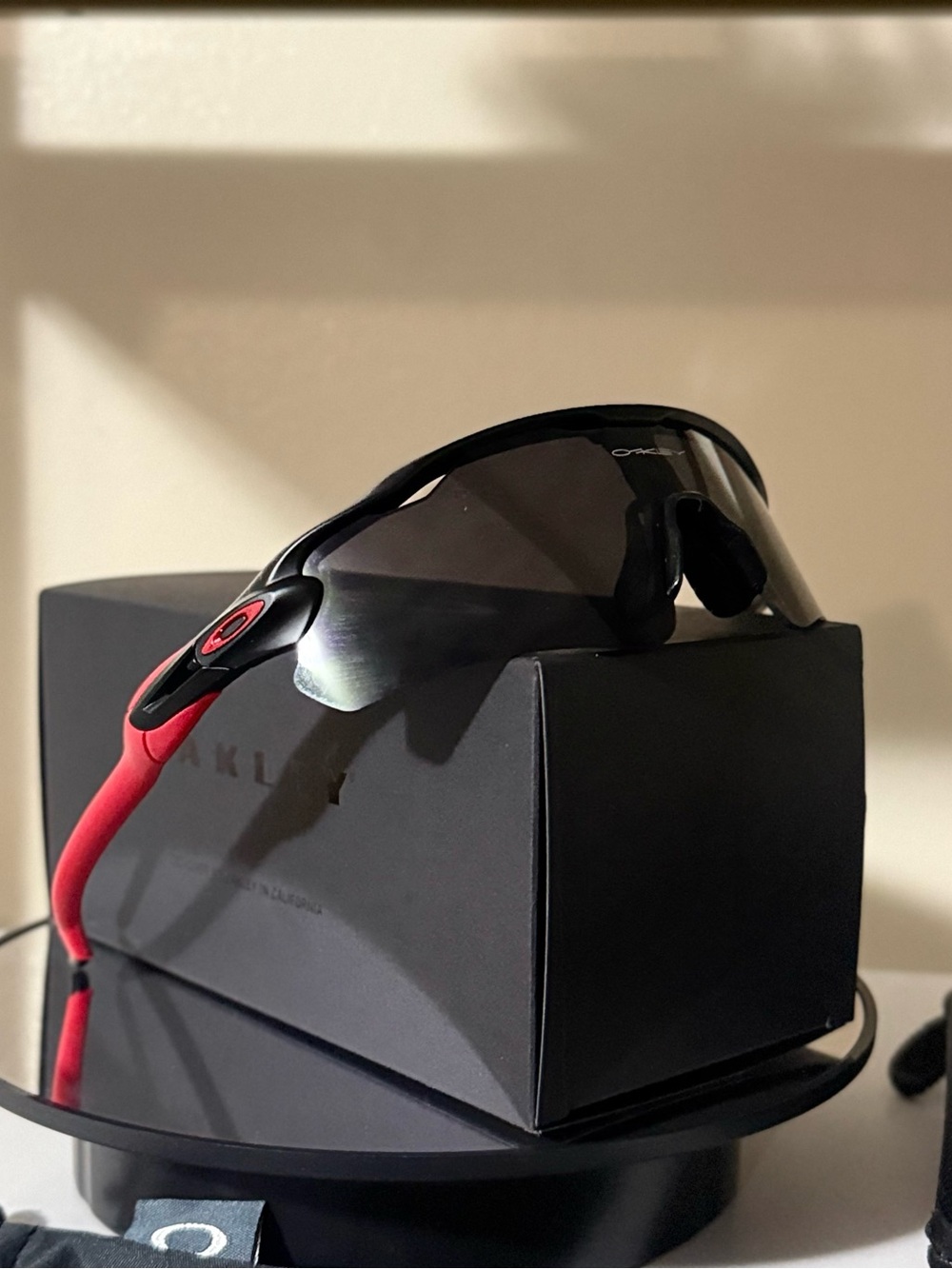 Oakley Black Frame Sunglasses with Red Temples